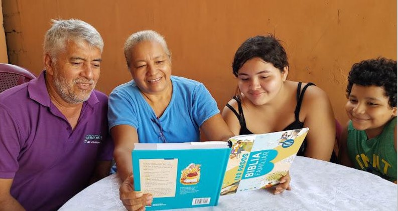 A family in Honduras reading the Family Bible